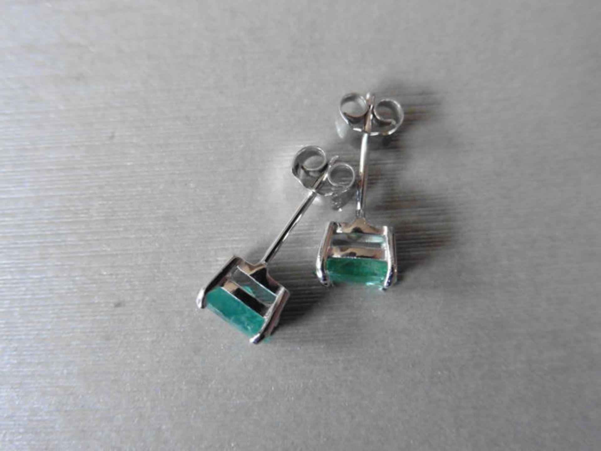 0.60ct emerald stud style earrings set in 9ct white gold. 7 x 5mm oval cut emeralds ( treated) set - Image 3 of 3