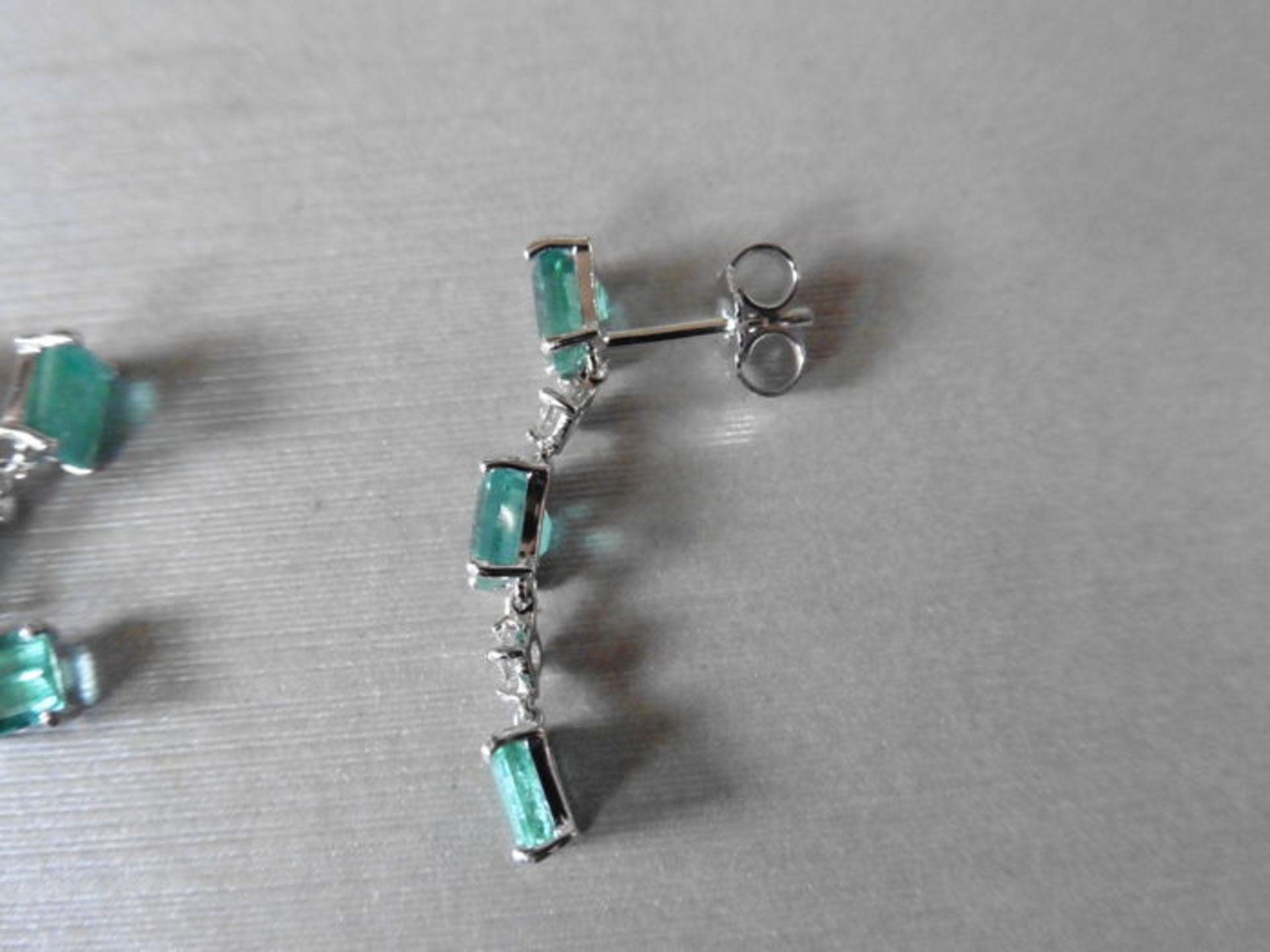 Emerald and diamond drop style earrings set in 18ct gold. Each set with 4 emerald cut ( treated) - Image 3 of 3