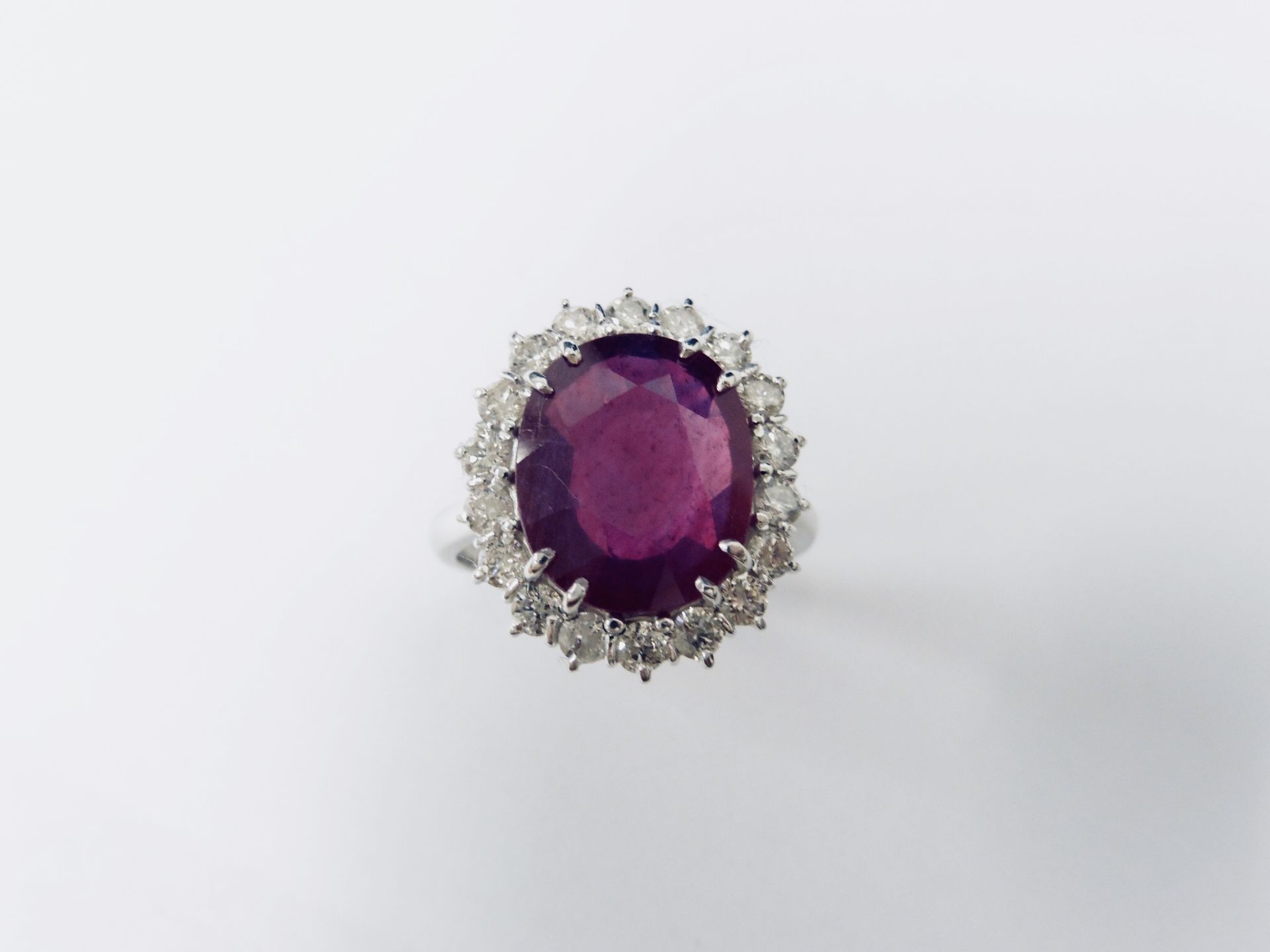 10ct ruby and diamond cluster ring. Oval cut ruby( glass filled) in the centre surrounded by - Image 3 of 5