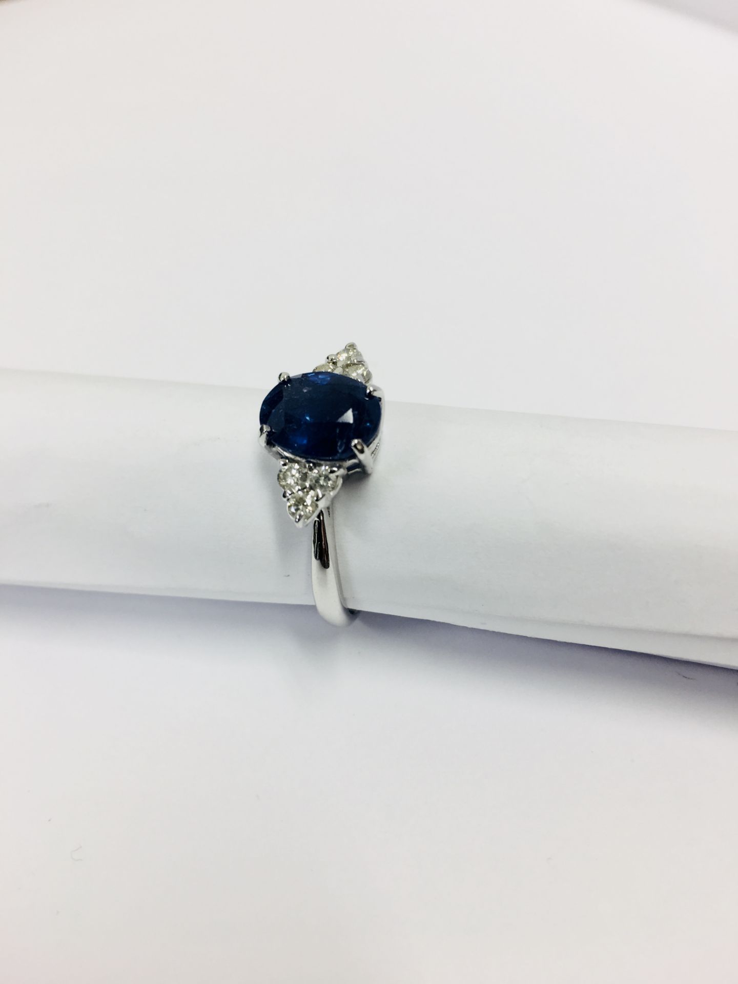 2.40ct Sapphire and diamond dress ring. Oval cut ( glass filled ) sapphire with 3 small brilliant - Bild 2 aus 4