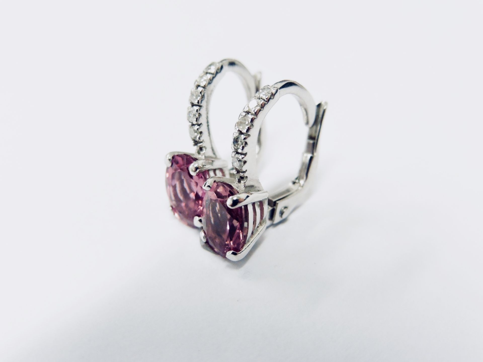 1.60ct Pink Tourmaline and diamond hoop style earrings. Each is set with a 7x 5mm oval cut - Image 3 of 4