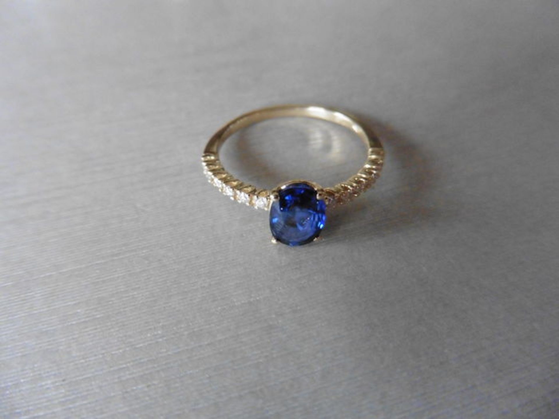 0.80ct / 0.12ct sapphire and diamond dress ring. Oval cut ( glass filled) sapphire with small - Bild 2 aus 3