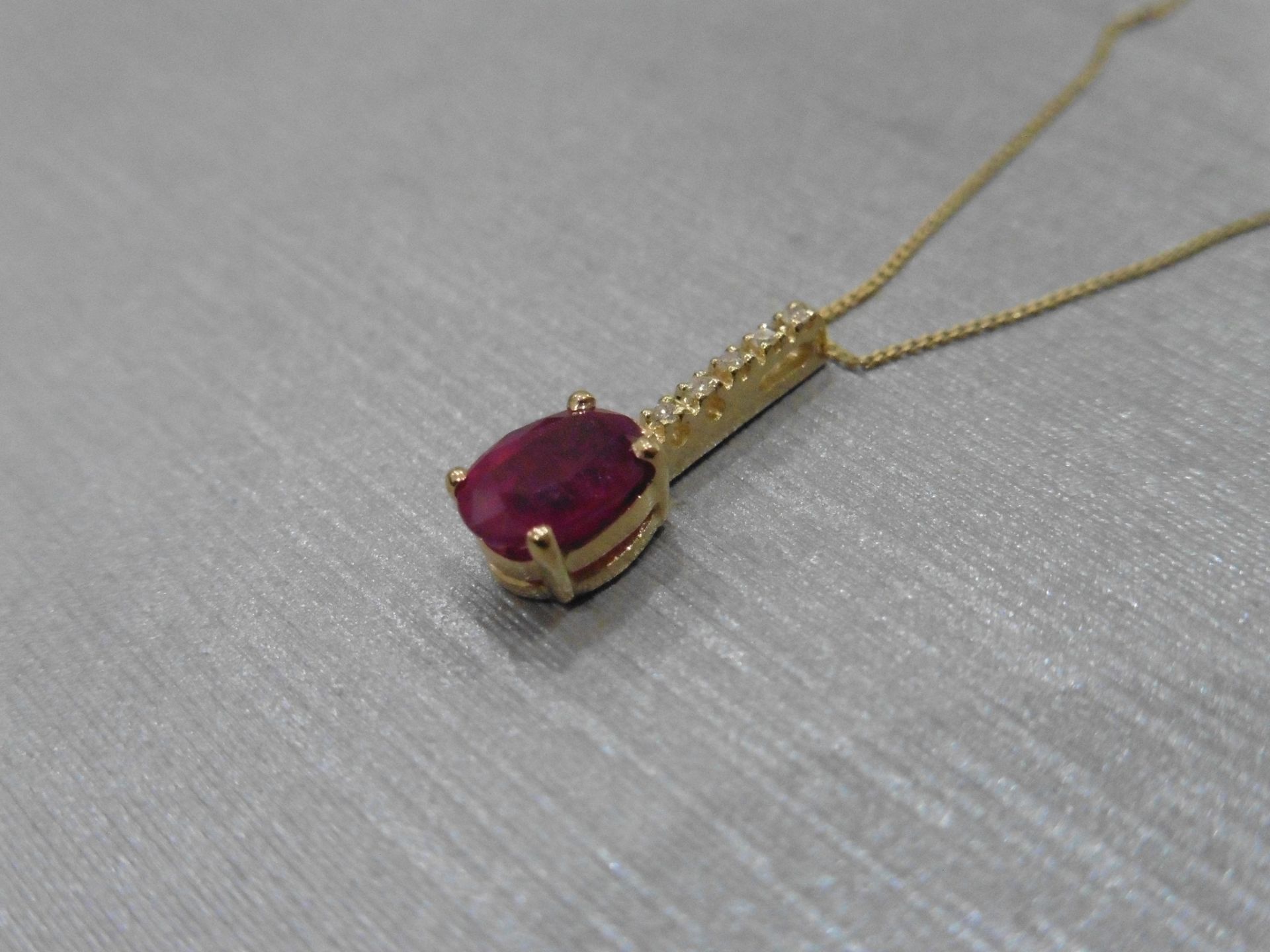 0.80ct ruby and diamond drop style pendant. 7X 5mm oval ruby set with 5 small brilliant cut - Image 2 of 3