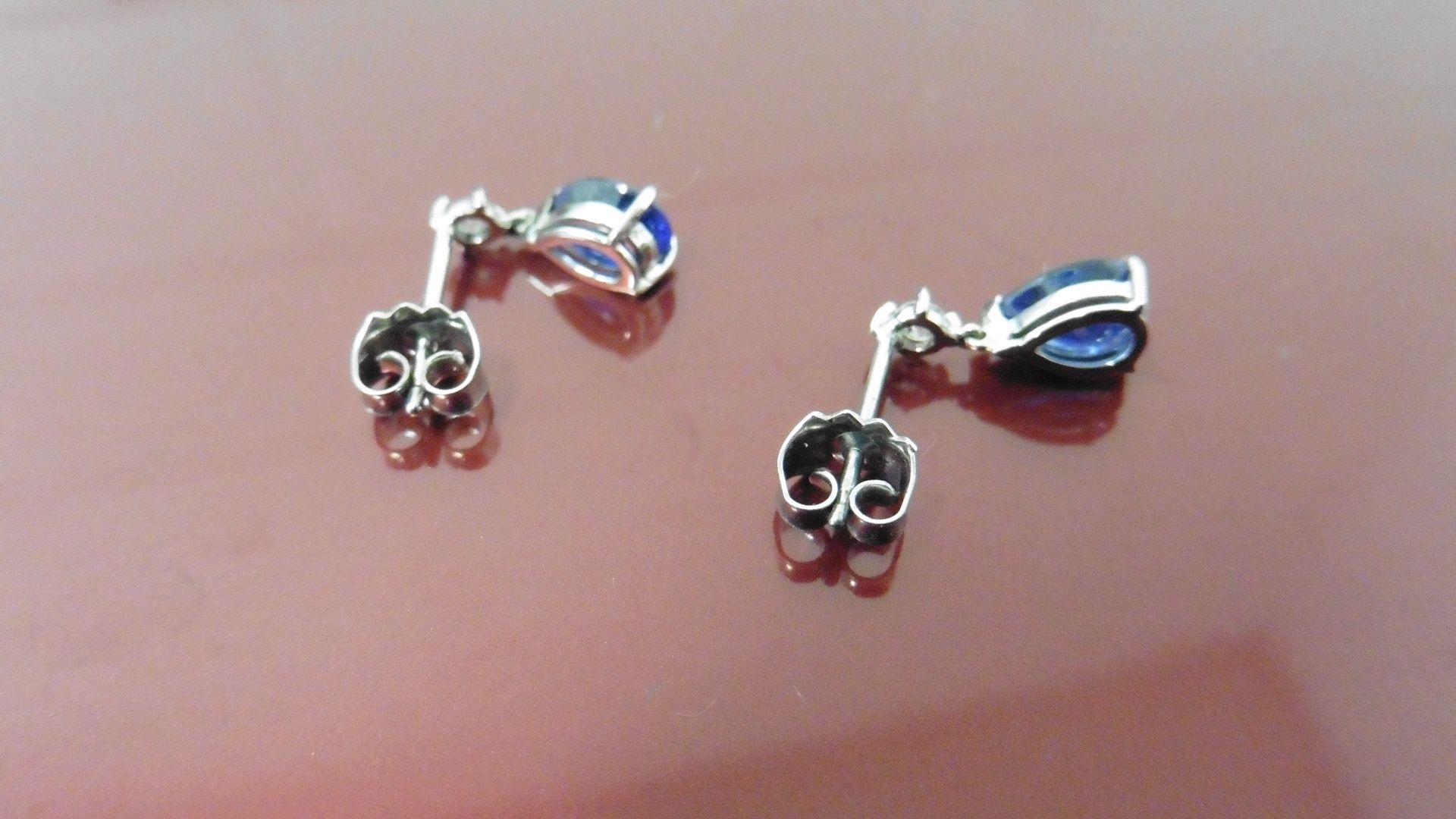 0.70ct drop style earrings. Each set with a pear-shaped Sapphire ( glass filled ) and a small - Image 3 of 4