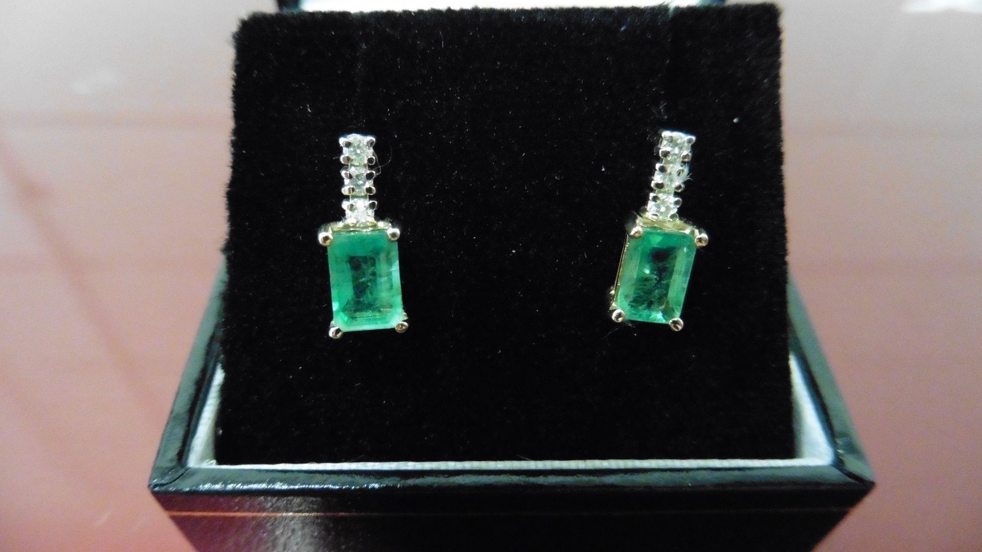 Emerald and diamond drop style earrings each set with an rectangular cut emerald, 6x4mm, weighing - Image 3 of 3