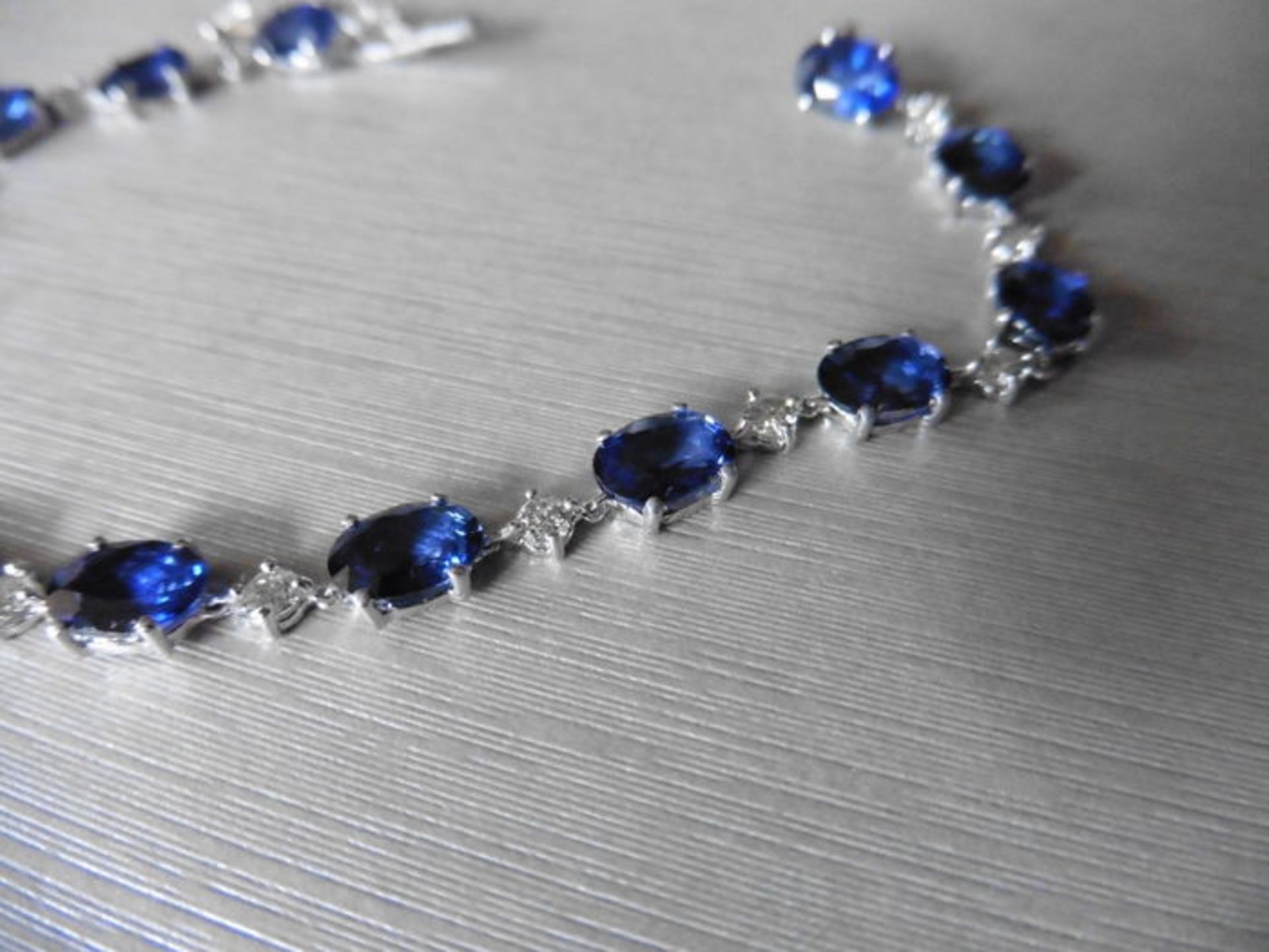 11ct sapphire and diamond bracelet.Set with oval ( treated ) sapphires and small brilliant cut - Image 2 of 4