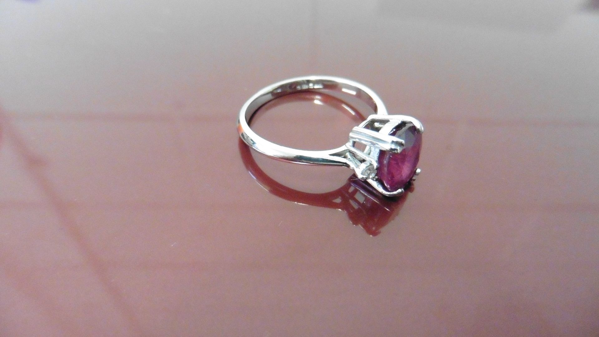 2.40ct Ruby and diamond dress ring. Oval cut ( glass filled ) ruby with a small brilliant cut - Bild 3 aus 3