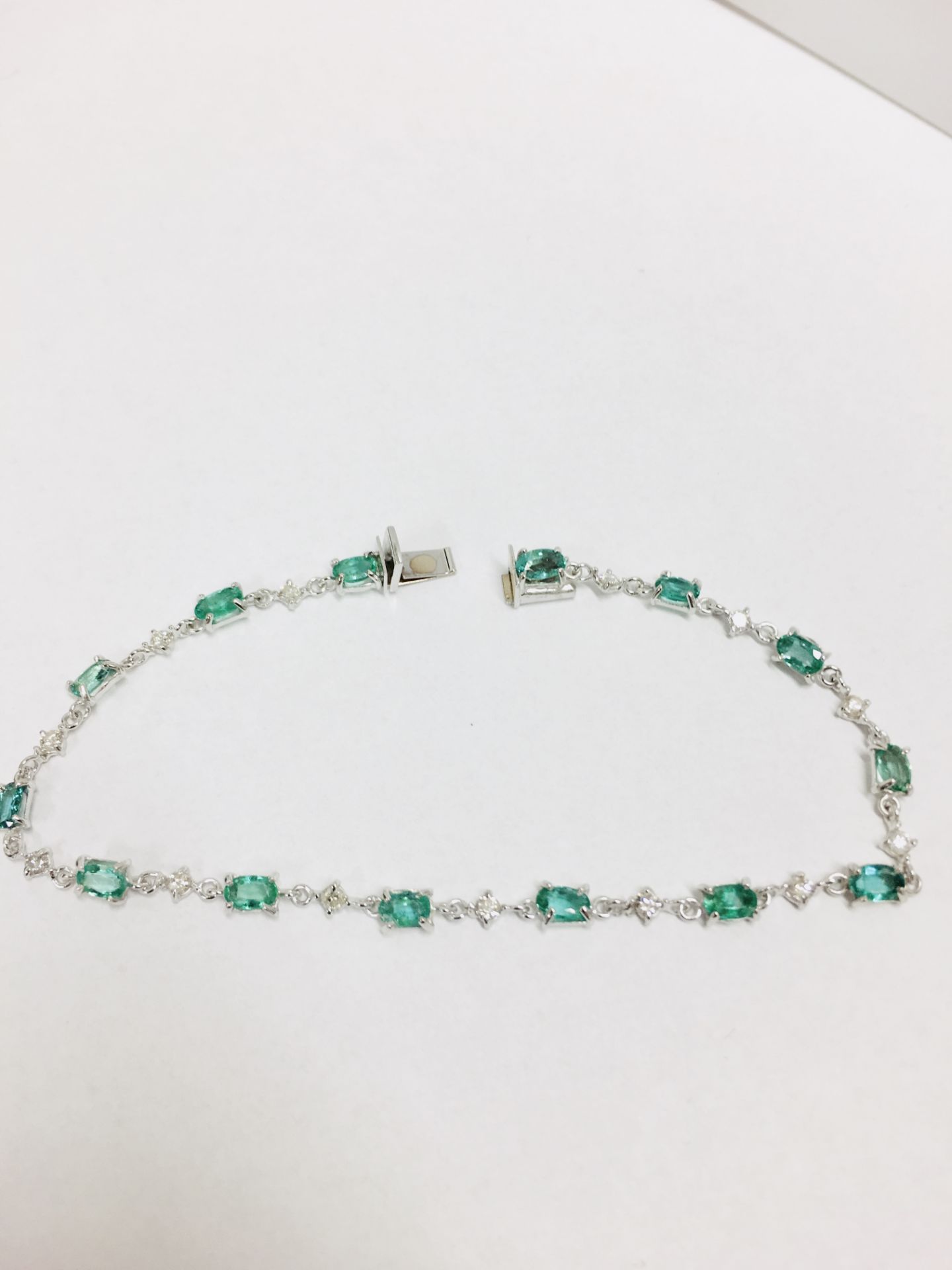 6ct emerald and diamond bracelet.Set with emerald cut ( treated ) emeralds and small brilliant cut