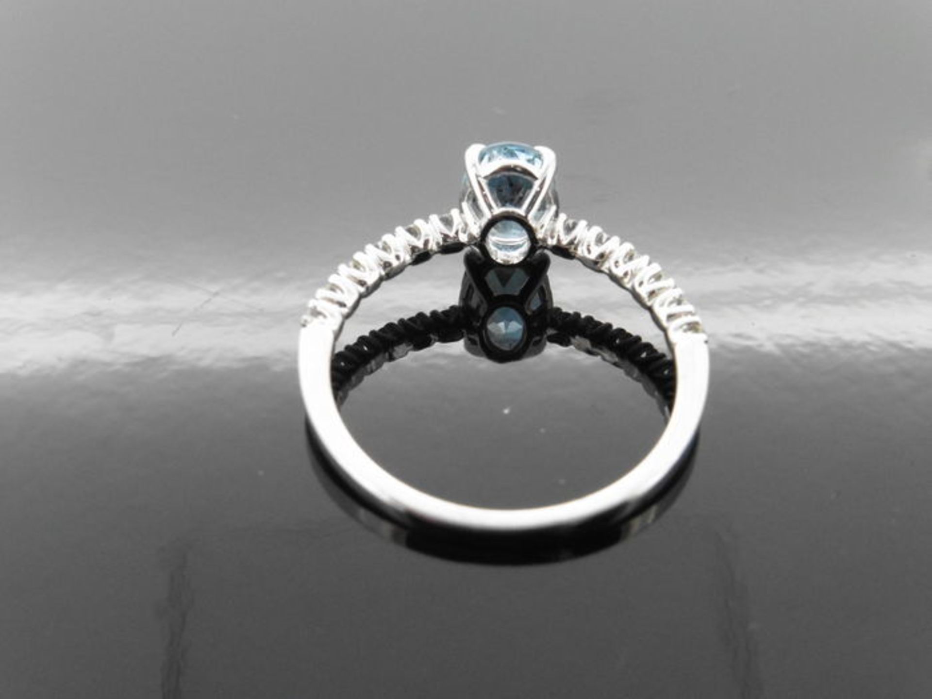 0.80ct / 0.12ct Aqua marine and diamond dress ring. Oval cut Aqua with small diamonds set into the - Image 2 of 3