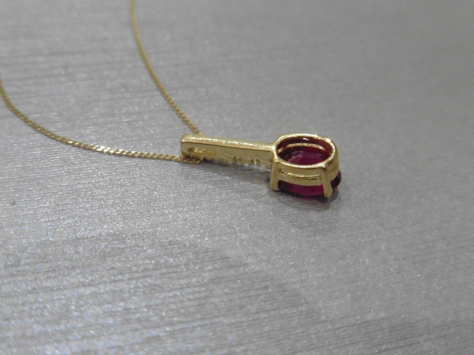 0.80ct ruby and diamond drop style pendant. 7X 5mm oval ruby set with 5 small brilliant cut - Image 3 of 3