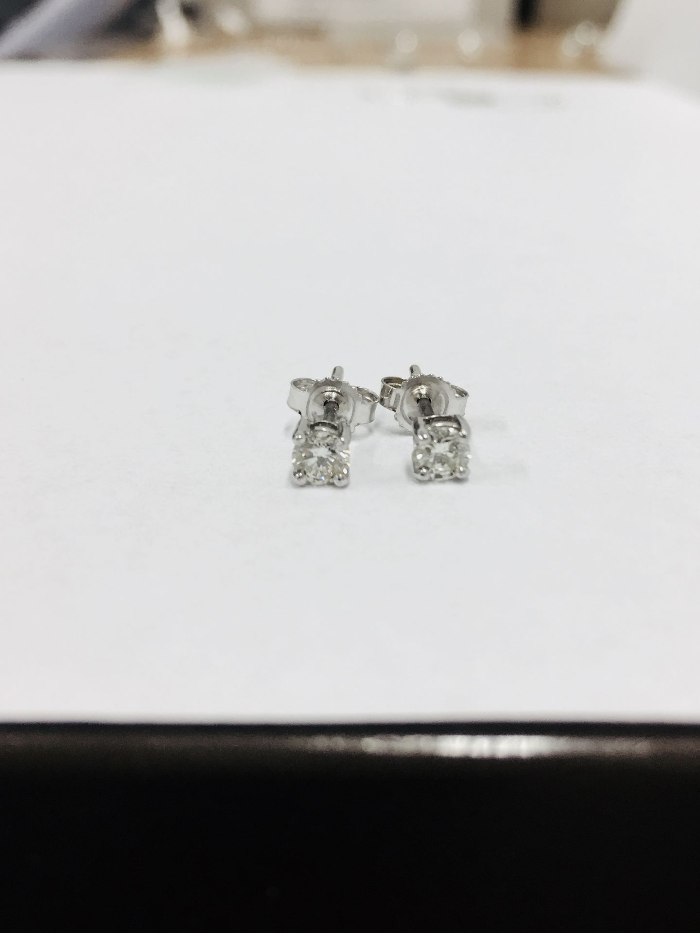0.50ct diamond solitaire stud earrings set in platinum. I/J colour, si2 clarity.4 claw setting - Image 3 of 3