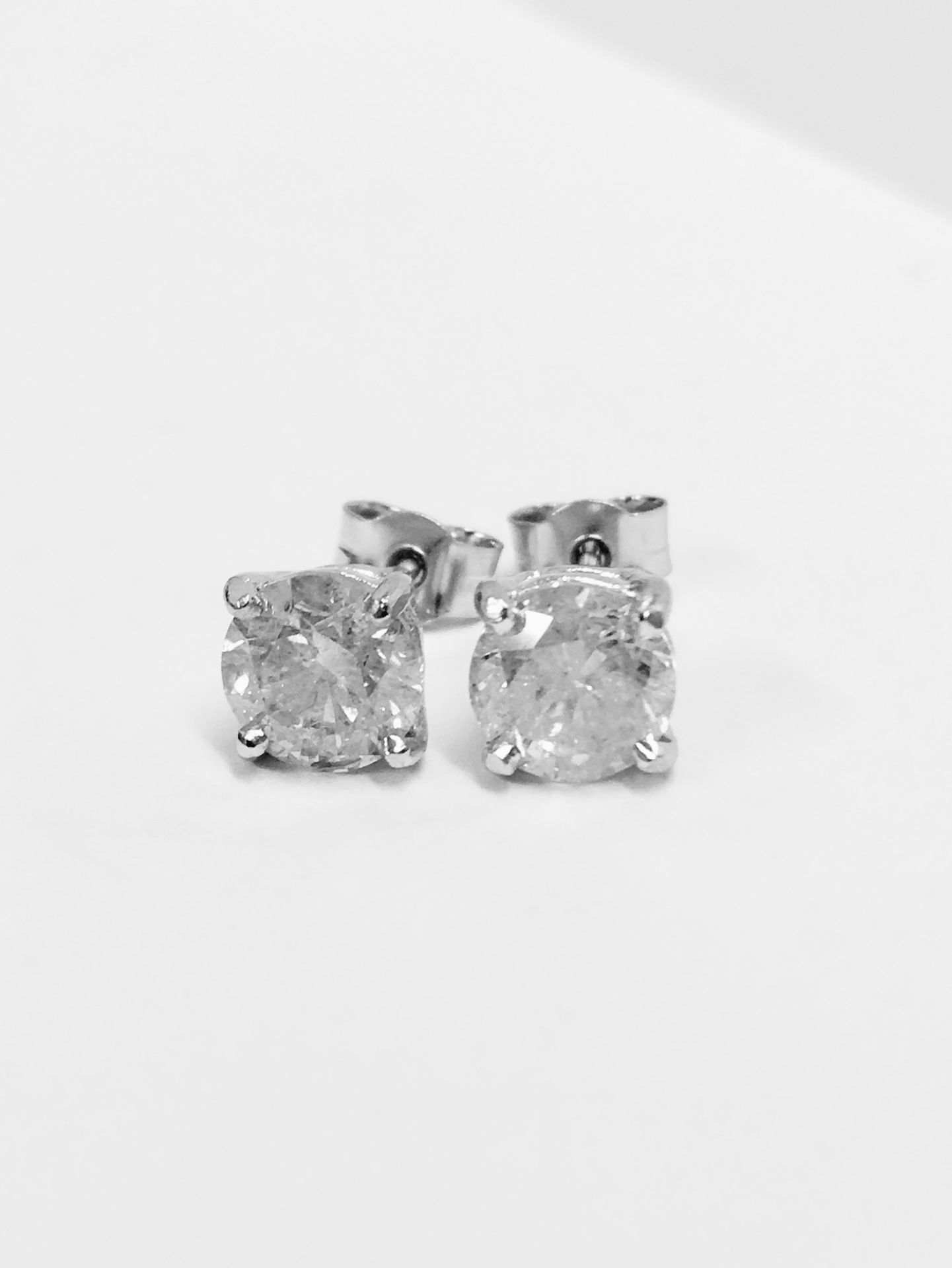 2.02ct Solitaire diamond stud earrings set with brilliant cut diamonds. I colour, I1-2 clarity Set