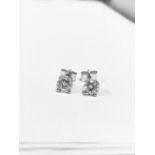 1.00ct diamond solitaire stud earrings set in platinum. I/J colour, si3-i1 clarity.4 claw setting