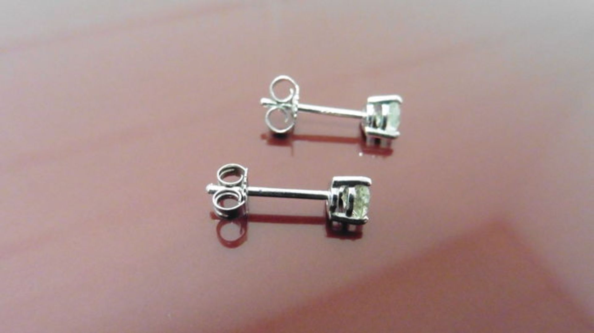 0.70ct diamond solitaire stud earrings set in platinum. I colour, si3 clarity. 3 claw setting with - Image 2 of 2