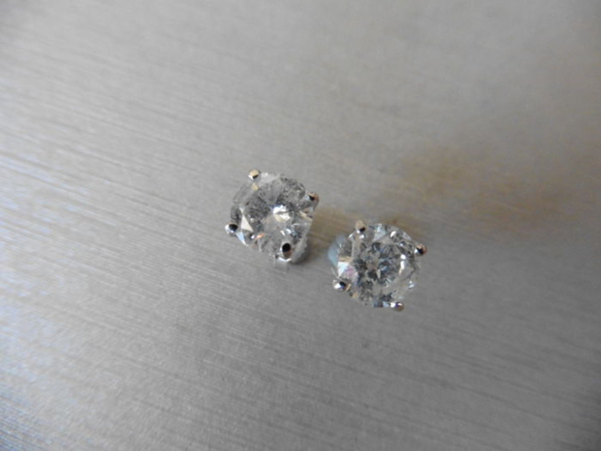 2.00ct Solitaire diamond stud earrings set with brilliant cut diamonds. I colour, I1-2 clarity Set