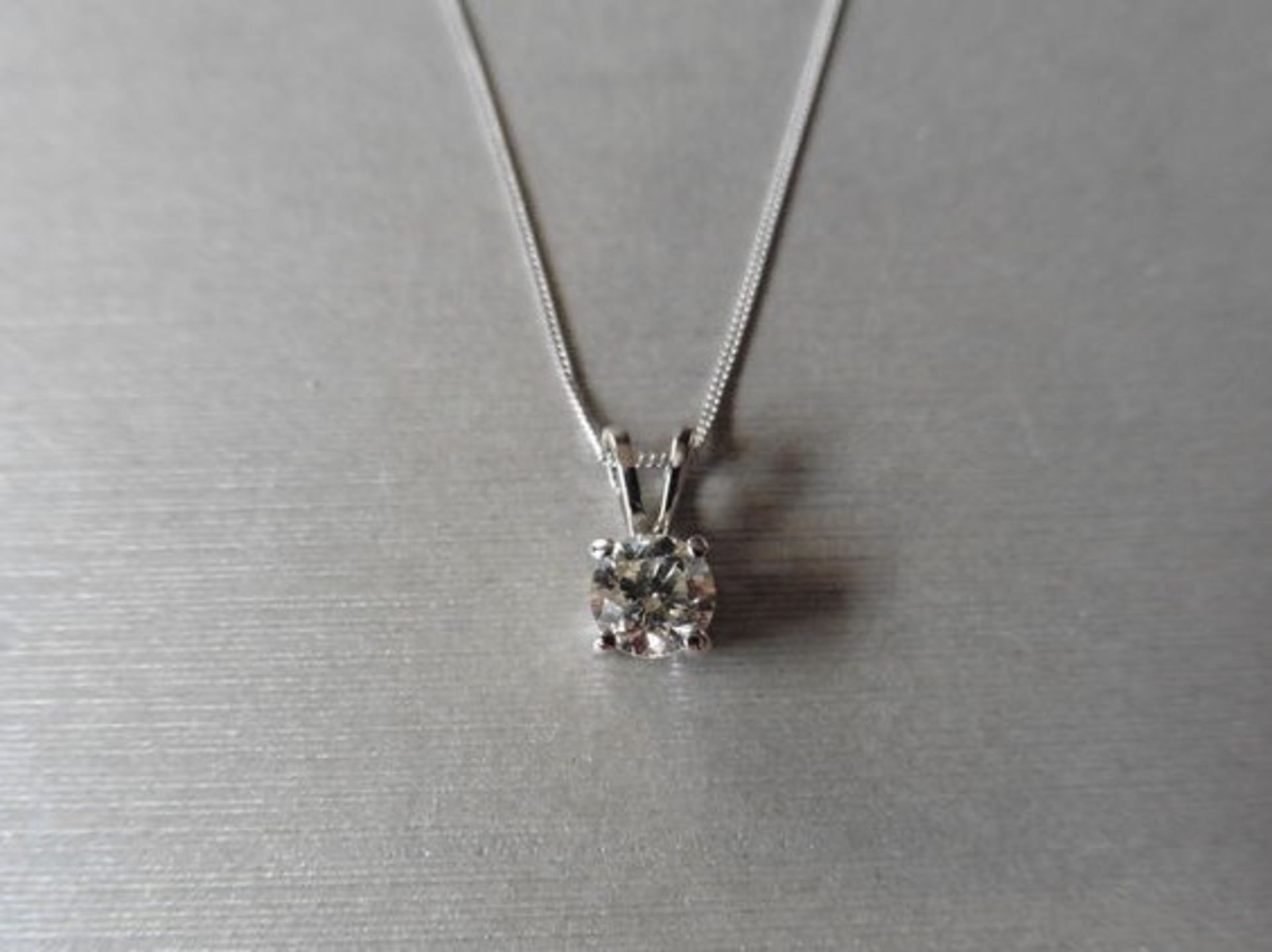 0.20ct diamond solitaire pendant. I colour, si2 clarity. Split bale attached in platinum 950. 9ct