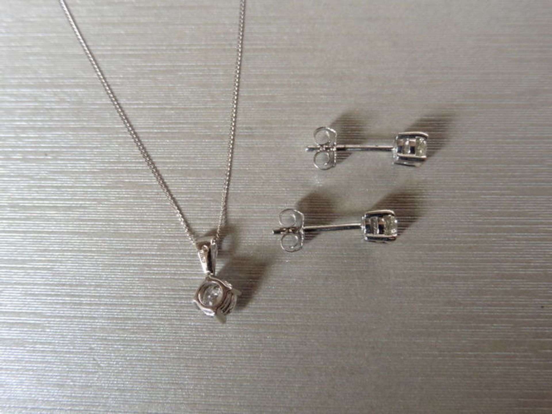 0.25ct / 0.50ct diamond pendant and earring set in platinum. Pendant - 0.25ct brilliant cut diamond, - Image 2 of 2