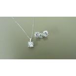 0.45ct / 0.80ct diamond pendant and earring set in platinum. Pendant - 0.40ct brilliant cut diamond,