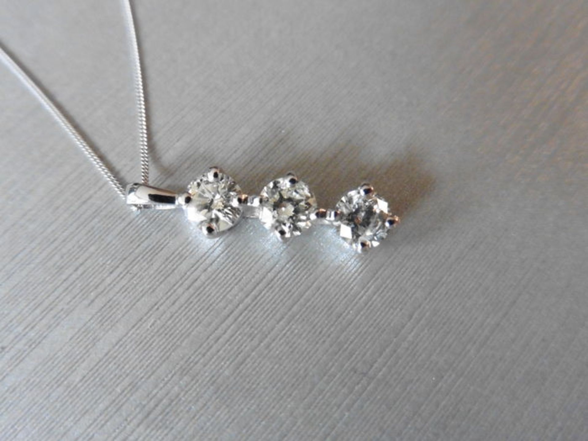 0.75ct trilogy diamond pendant. 3 brilliant cut diamonds, I/J colour, si2-3 clarity. 4 claw