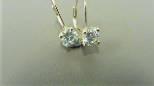 18ct yellow gold hoop style earrings with hinge fastners. 2 x 0.50ct Brilliant cut diamonds, H