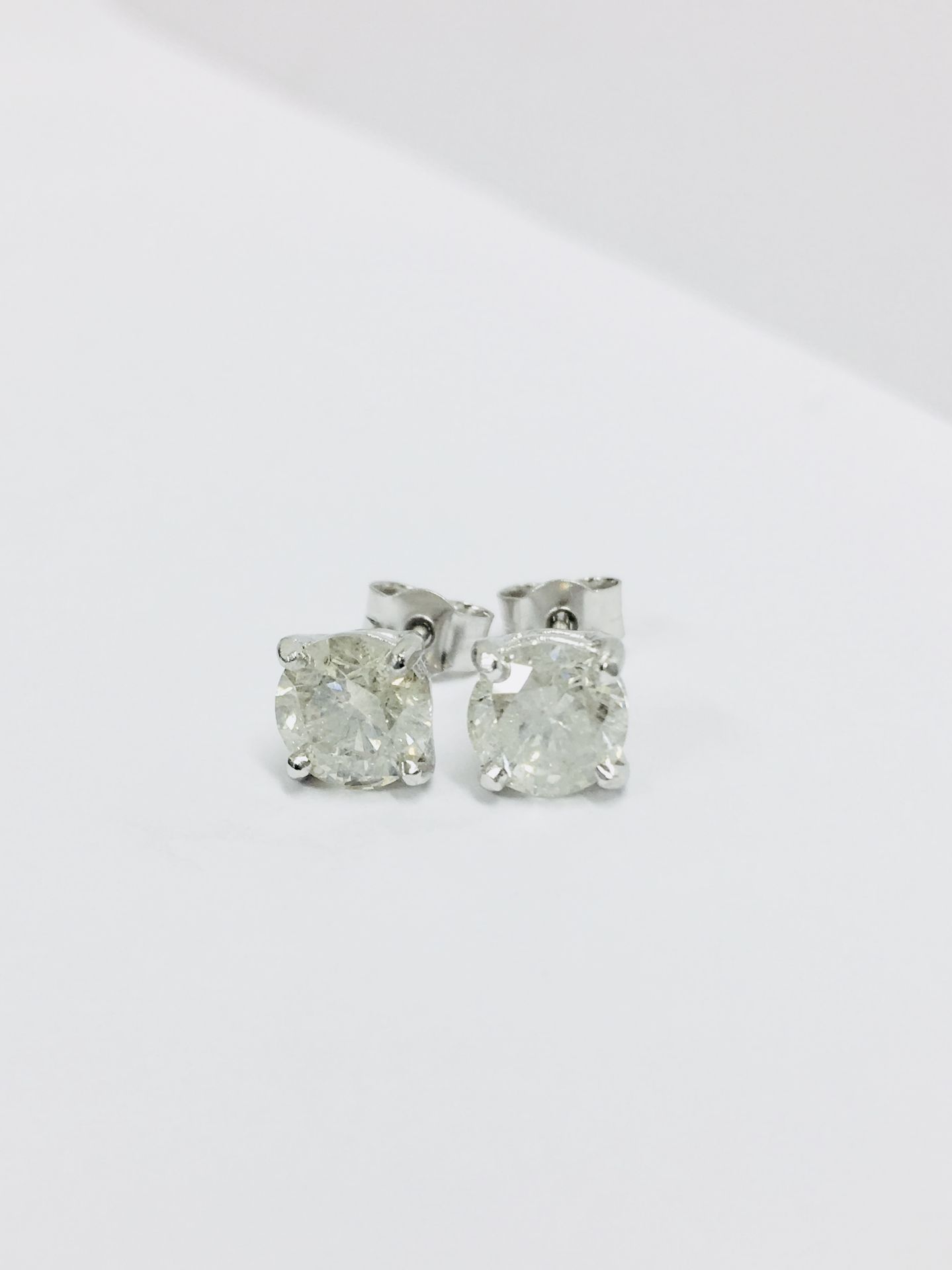 2.00ct Solitaire diamond stud earrings set with brilliant cut diamonds which have been enhanced. I - Image 2 of 4