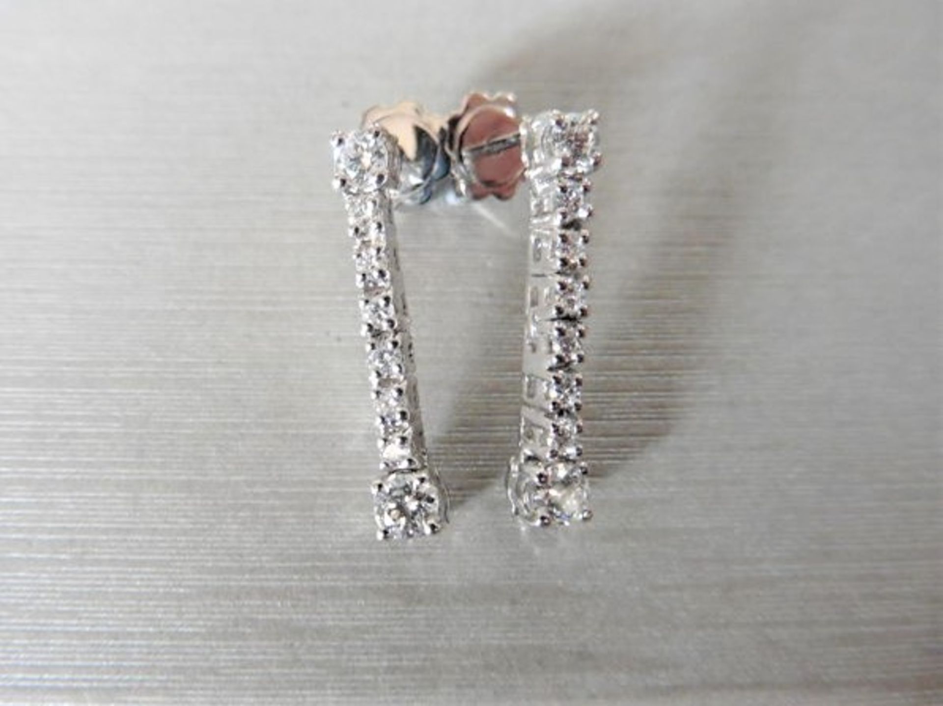 0.62ct diamond drop earrings set in 18ct white gold. Brilliant cut diamonds, I colour and Si3