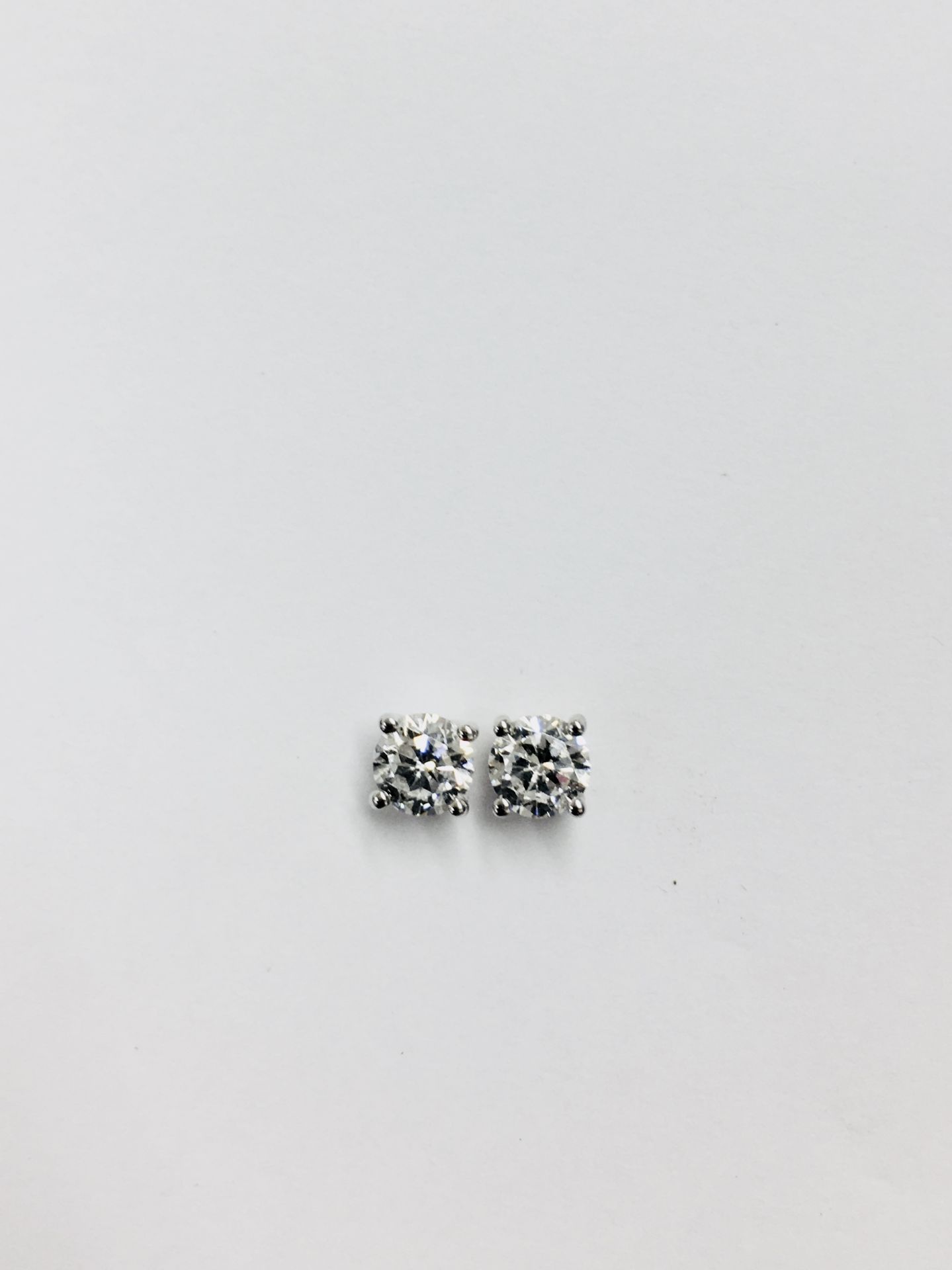 1.00ct diamond solitaire earrings set in platinum. 2 x brilliant cut diamonds, 0.50ct ( enhanced ) H - Image 3 of 3