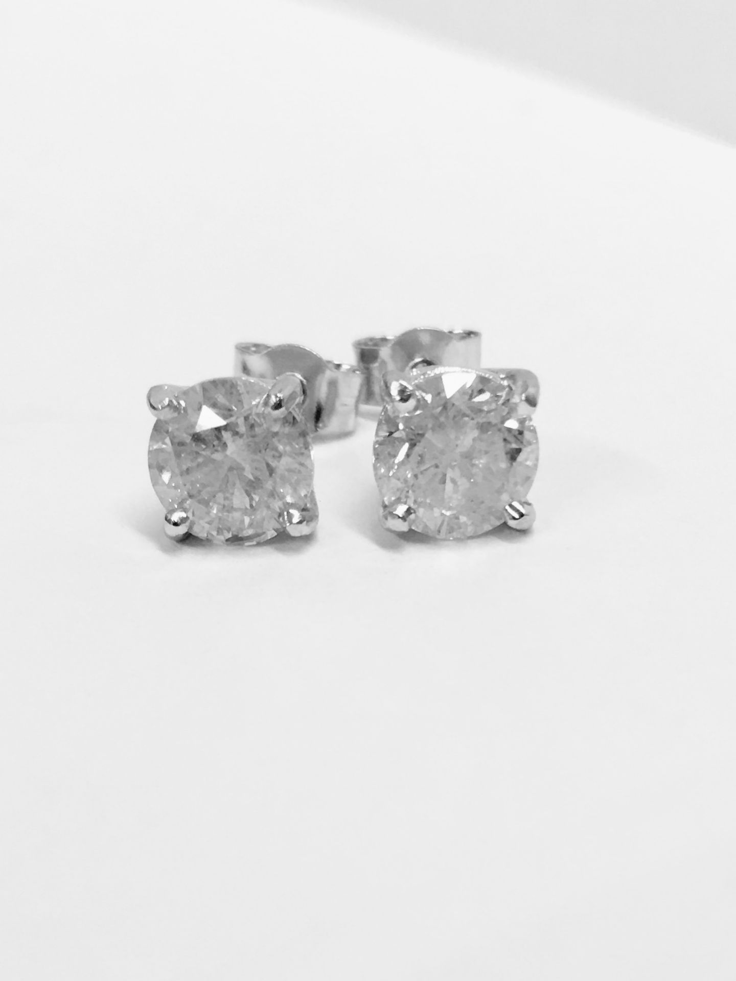 2.00ct Solitaire diamond stud earrings set with brilliant cut diamonds which have been enhanced. H/I - Image 2 of 3