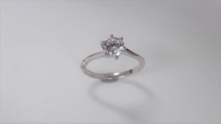 0.60ct ct diamond twist solitaire ring set in platinum. 6 claw setting. Enhanced brilliant cut