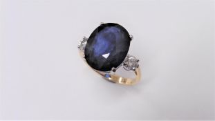 9ct sapphire and diamond trilogy ring set in 18ct gold. Oval cut sapphire ( fracture filled )