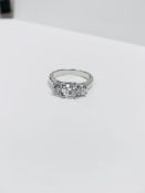 1.15ct Diamond three stone ring .18ct white gold 0.70ct centre 0.30ct outer i1 h Colour 4 claw