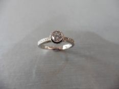 18ct white gold diamond set solitaire ring with a Brilliant cut diamond weighing 0.41ct secured in a