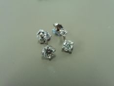 18ct white golddrop style earrings. Each has 2 brilliant cut diamonds, I colour, si3 clarity.
