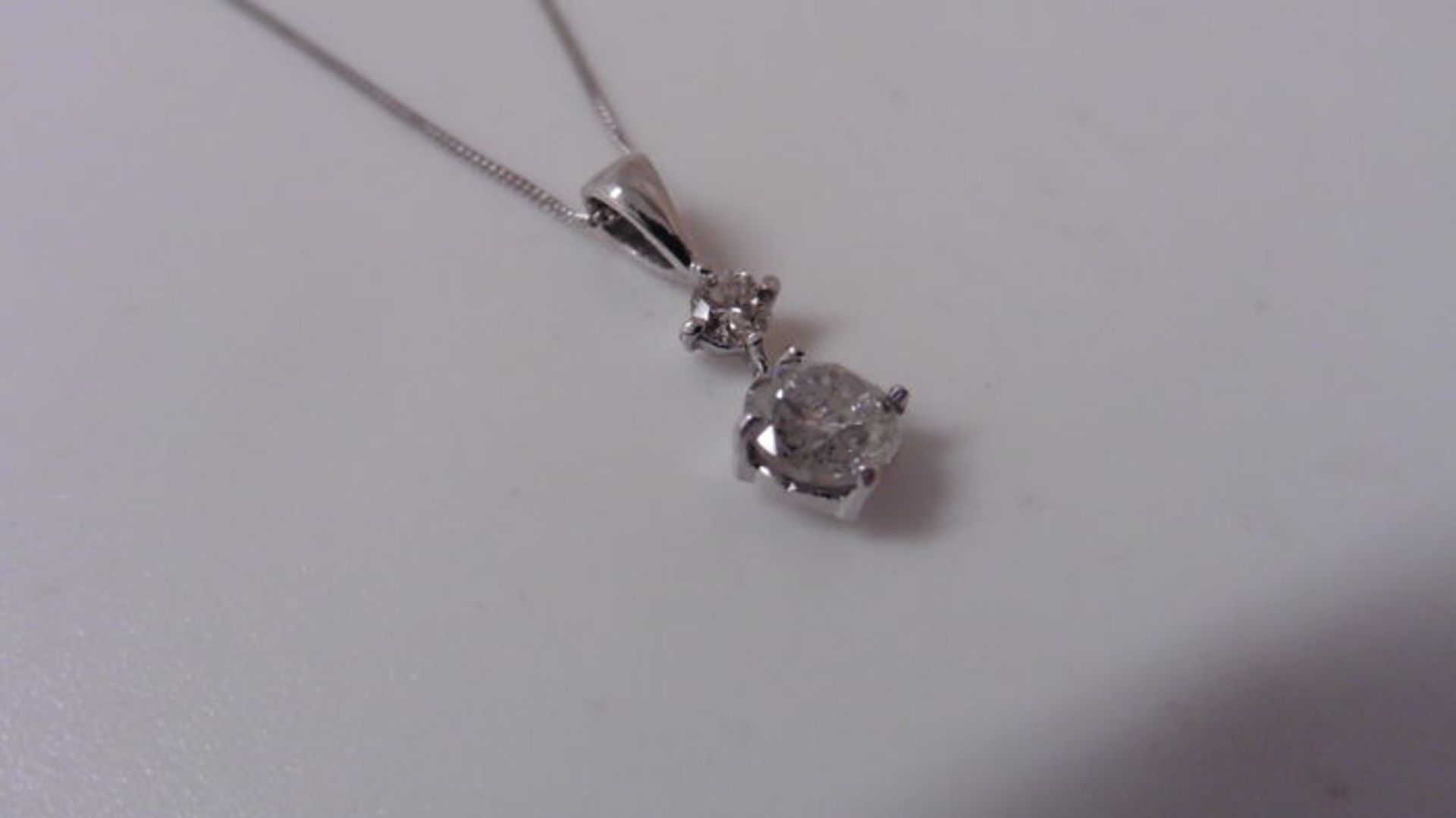 0.60ct diamond drop pendant set in 18ct white gold. 0.50ct on the bottom with 0.10ct on top. I-J