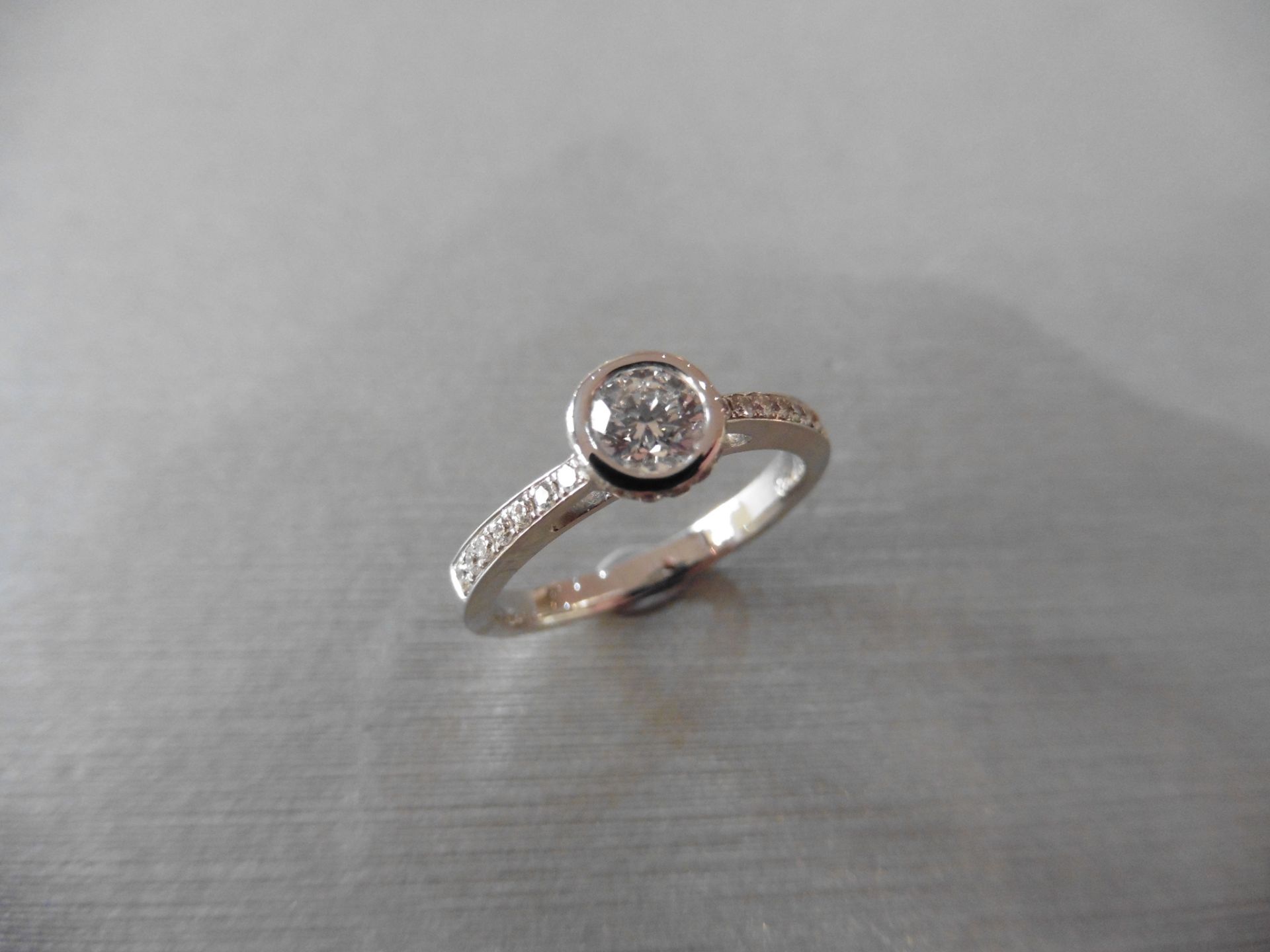 18ct white gold diamond set solitaire ring with a Brilliant cut diamond weighing 0.41ct secured in a - Bild 4 aus 4
