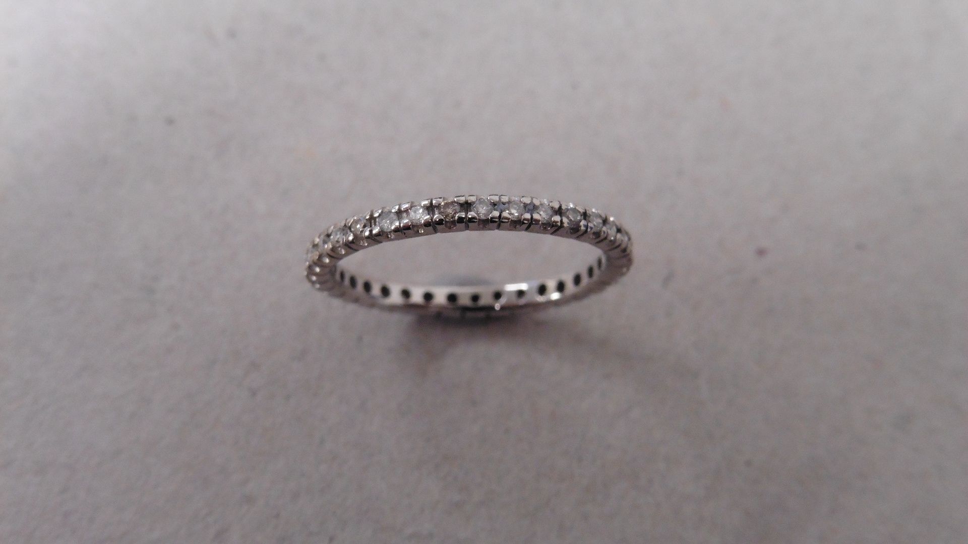 0.26ct diamond set band ring. Brilliant cut diamonds set all the way round in a micro claw - Image 3 of 3