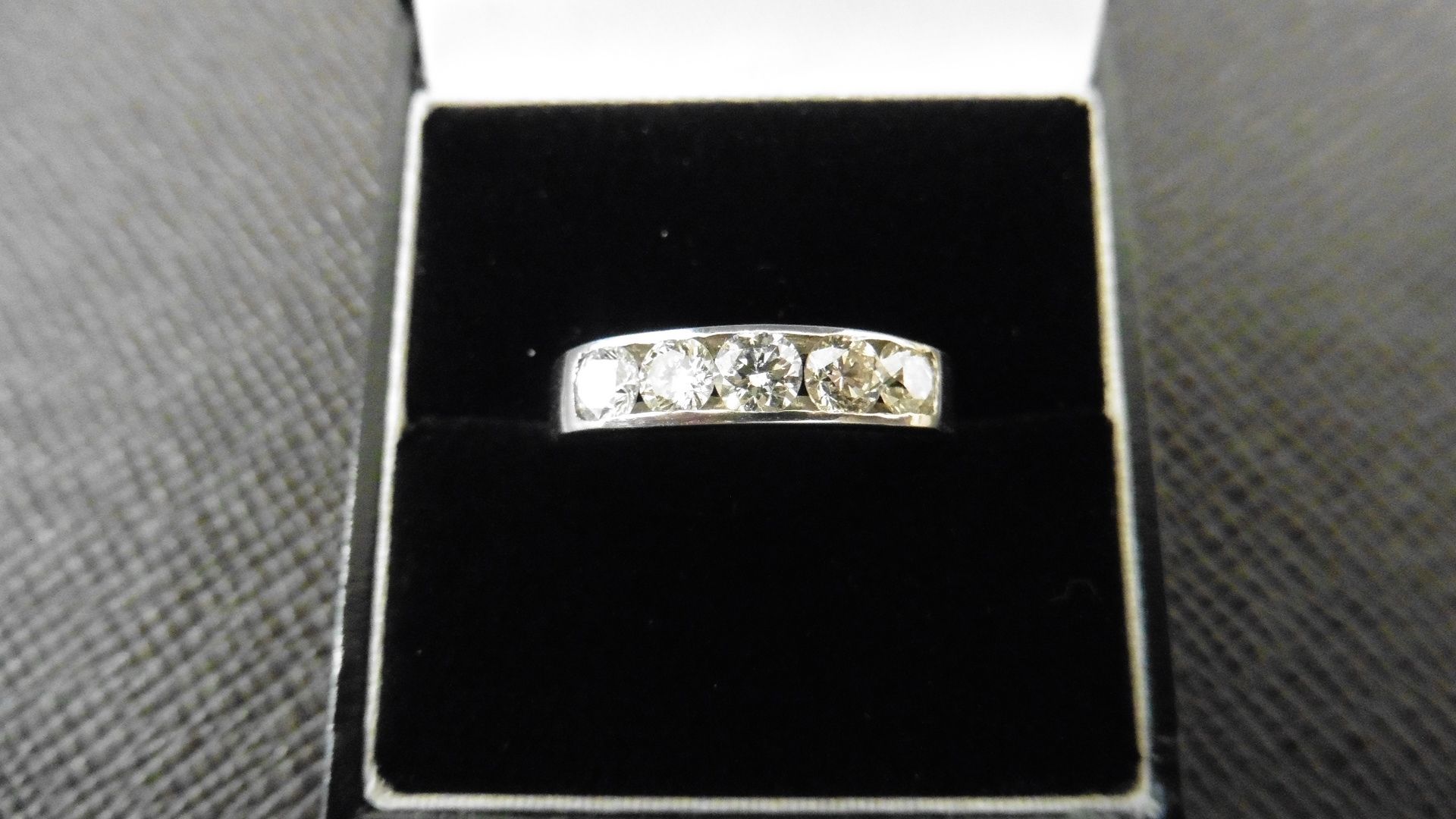 1.25ct diamond band ring. 5 brilliant cut diamonds, I colour and si3 clarity. Channel setting set in - Image 3 of 3