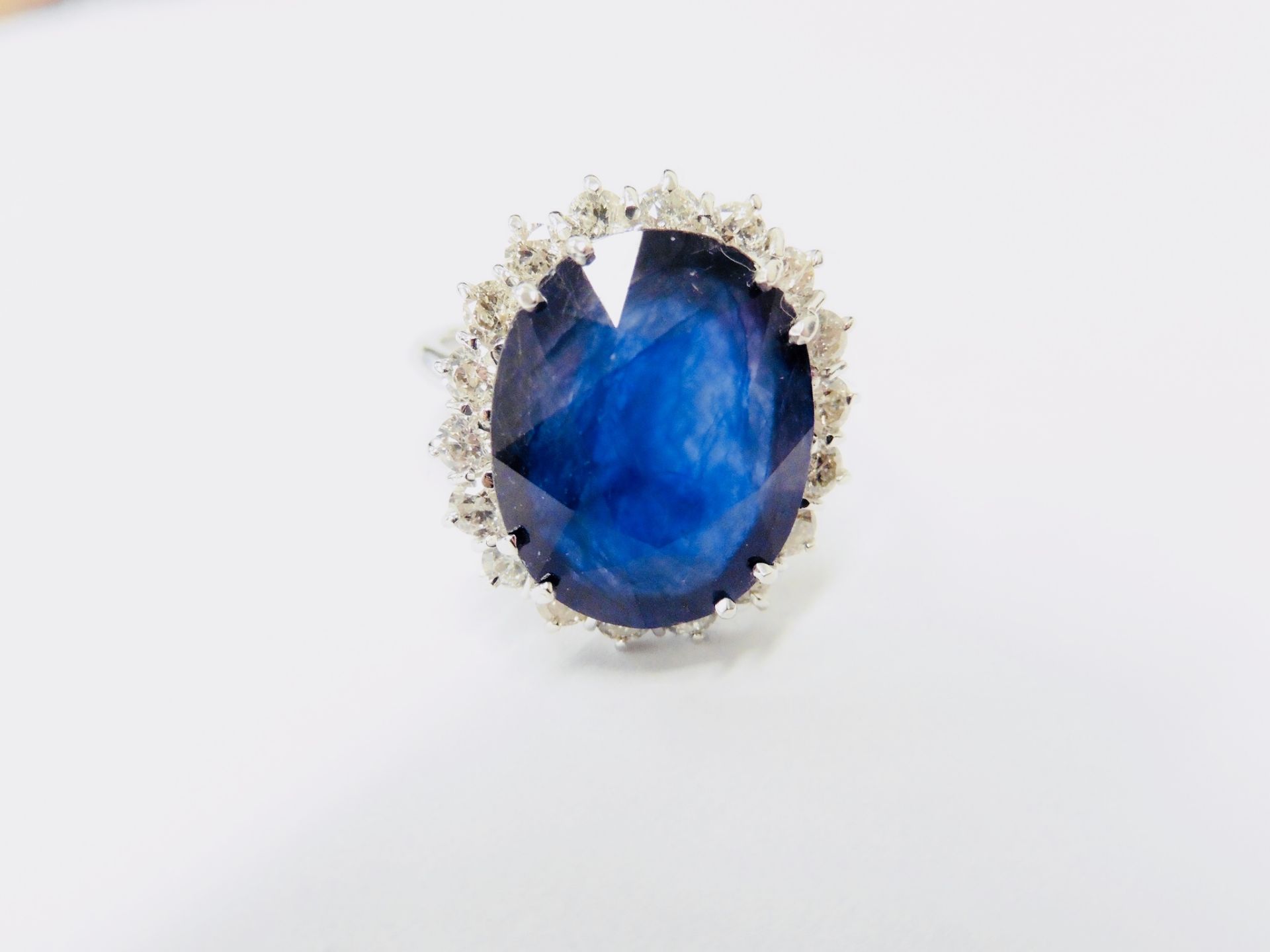 9ct Sapphire Diamond cluster ring,9ct sapphire natural(treated),1.30ct brilliant cut diamonds si2