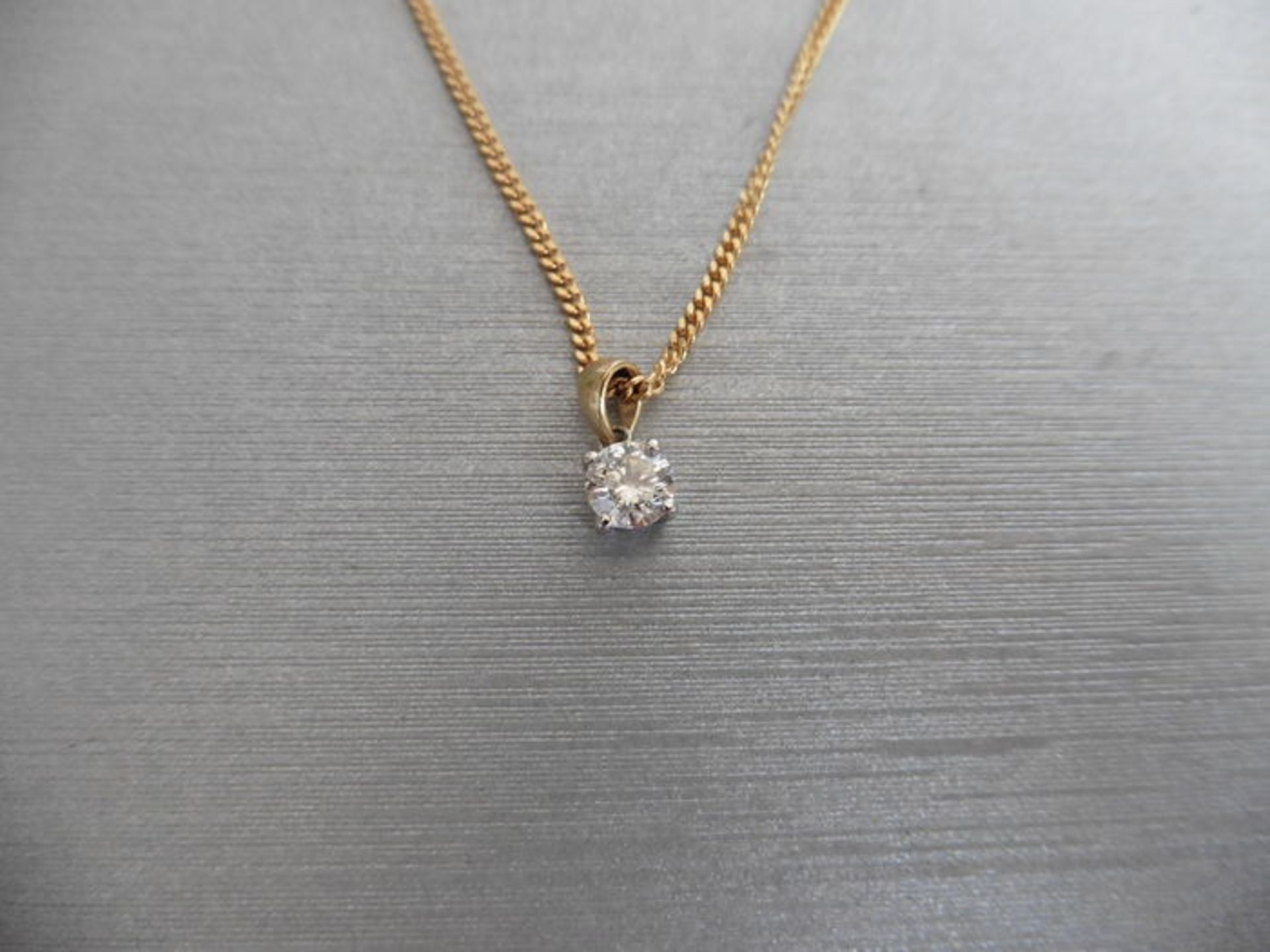 0.25ct diamond solitaire pendant set in 18ct gold. Brilliant cut diamond, I colour and si3