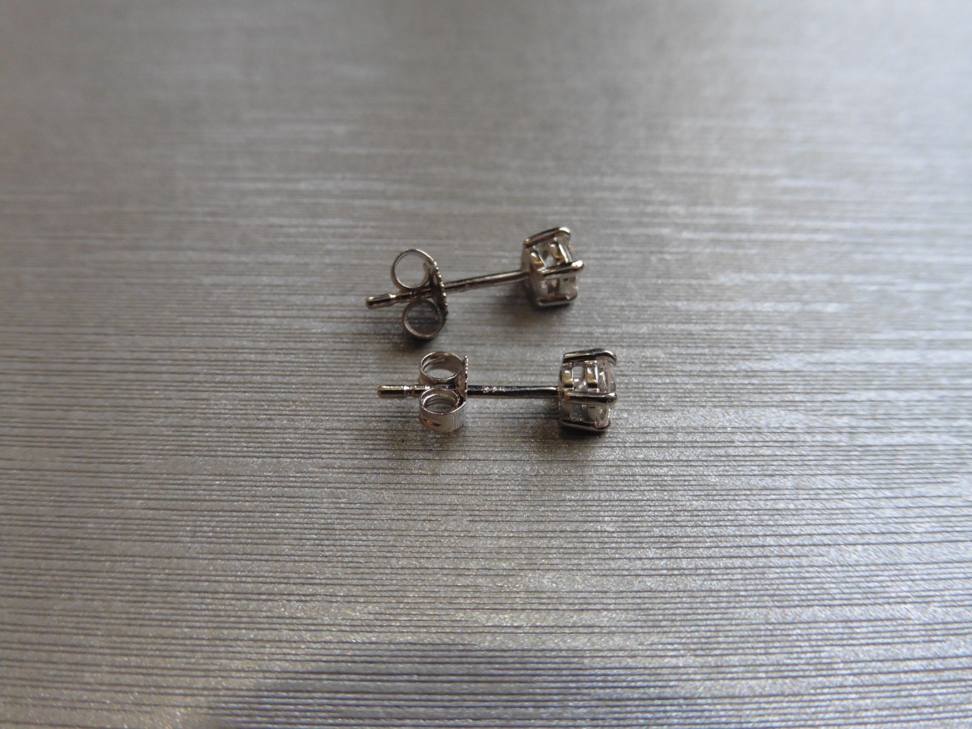 0.60ct Solitaire diamond stud earrings set with brilliant cut diamonds, SI2 clarity and I colour. - Bild 3 aus 4