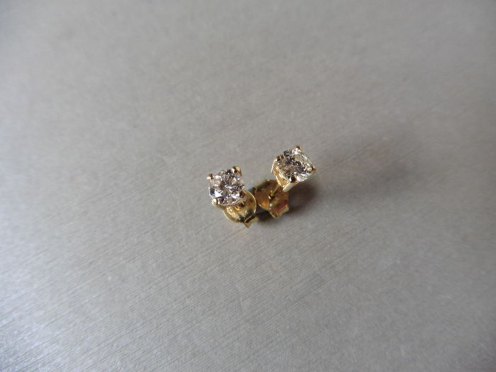 0.30ct Solitaire diamond stud earrings set with brilliant cut diamonds, SI2 clarity and I colour.