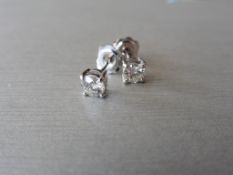 0.90ct Solitaire diamond stud earrings set with brilliant cut diamonds. SI2 clarity and I colour.