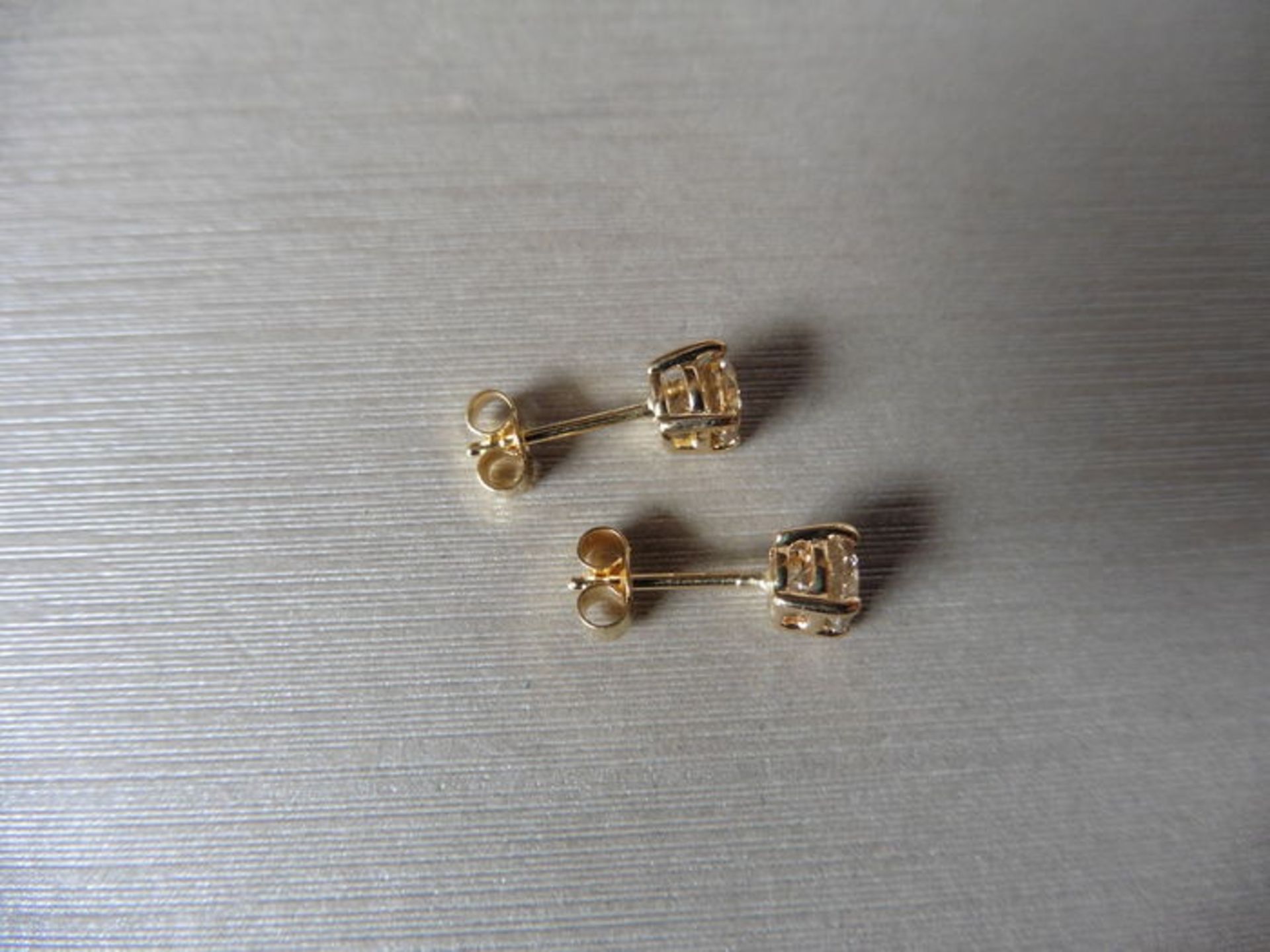 0.75ct Solitaire diamond stud earrings set with brilliant cut diamonds, SI2 clarity and I/J - Bild 2 aus 2