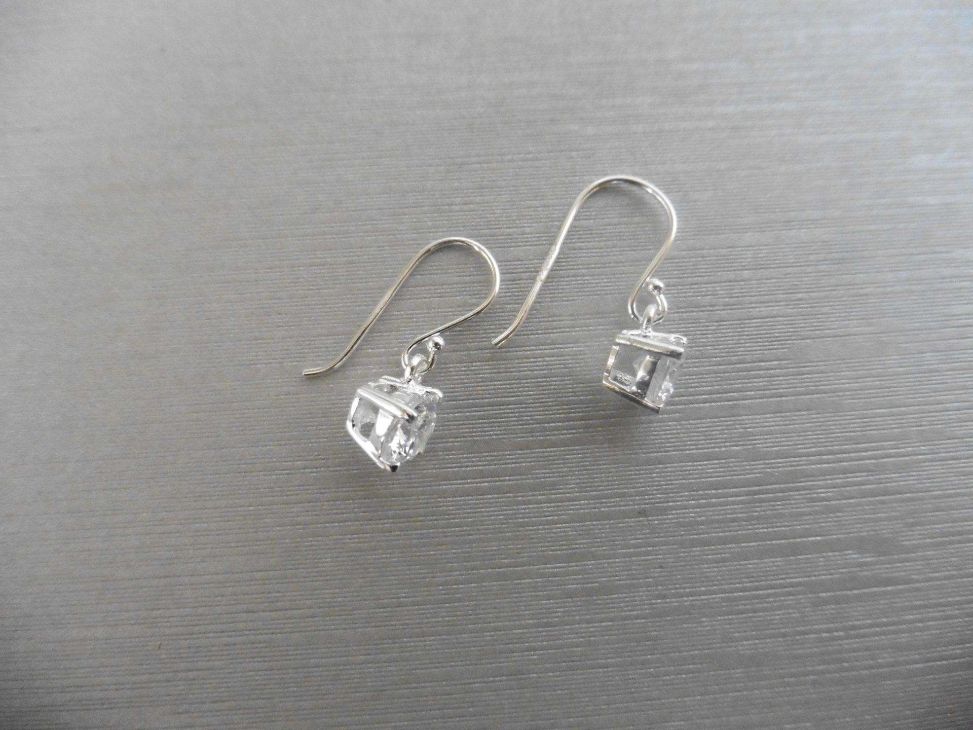 1.00ct diamond drop style solitaire earrings each set with a brilliant cut diamond, I/J colour,