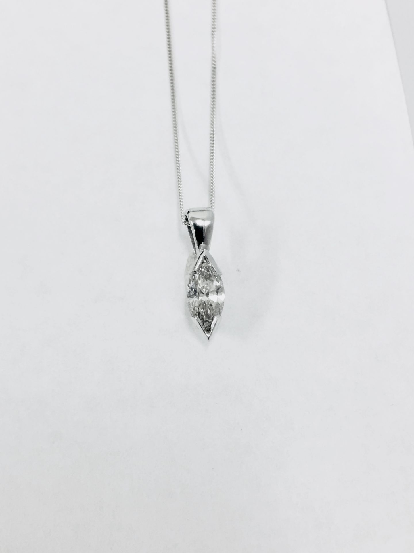 0.45ct diamond pendant with a marquise diamond. H colour and si1 clarity. 2 claw setting with