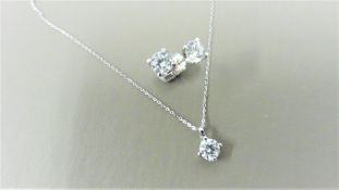 0.35ct / 0.70ct diamond pendant and earring set in platinum. Pendant - 0.35ct brilliant cut diamond,