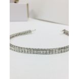 5.70 princess cut tennis bracelet ,73 princess diamonds si garde h colour,16.87gms 18ct white gold,