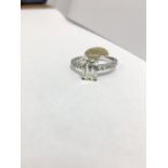 1.50ct Emerald cut j colour vs clarity,10x0.01ct diamonds brilliant cut set in 18ct white gold