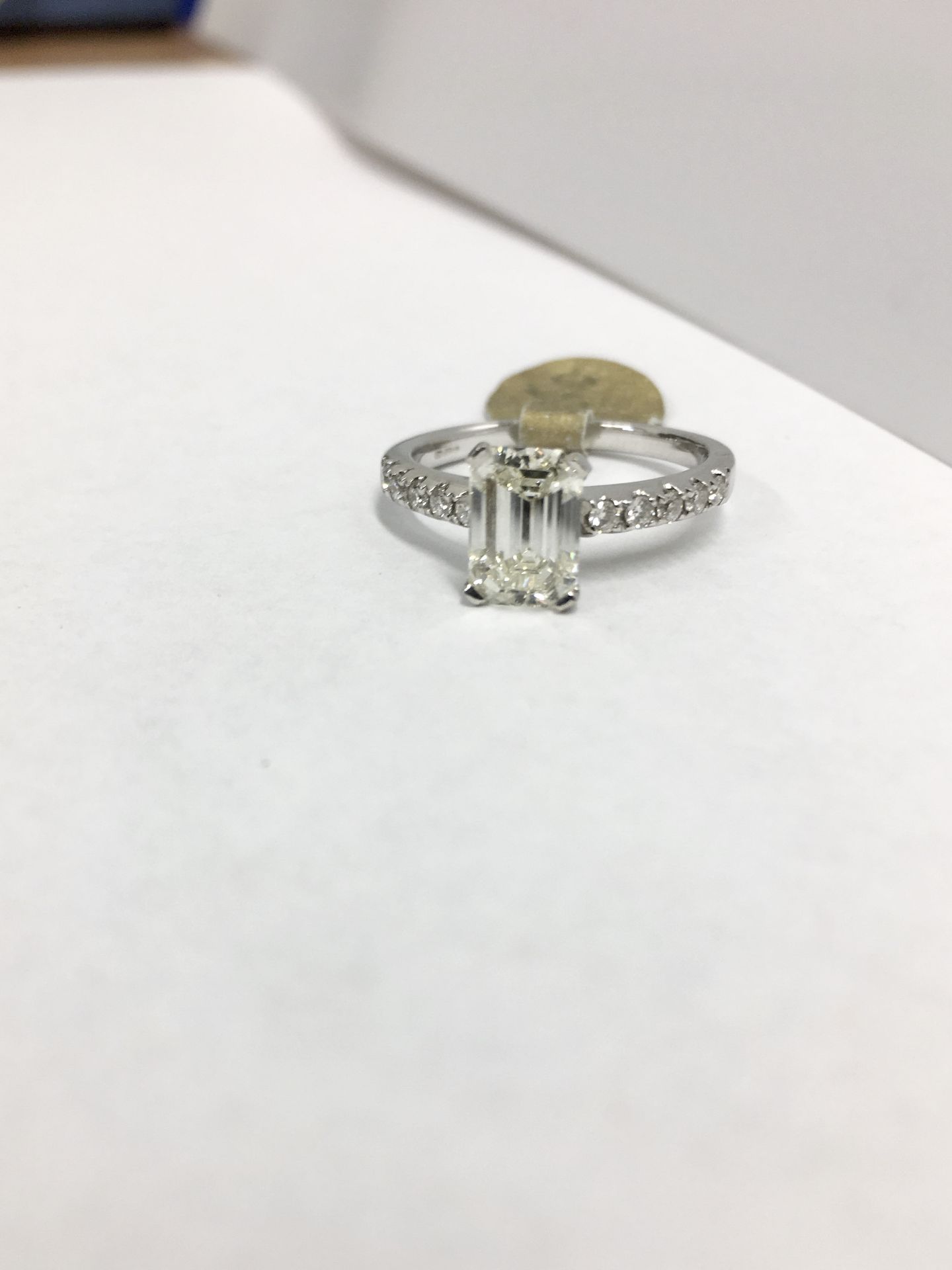 1.50ct Emerald cut j colour vs clarity,10x0.01ct diamonds brilliant cut set in 18ct white gold