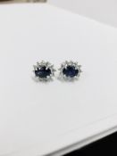 1.60ct Sapphire and Diamond cluster style stud earrings. Each Sapphire ( glass filled ) measures 7mm